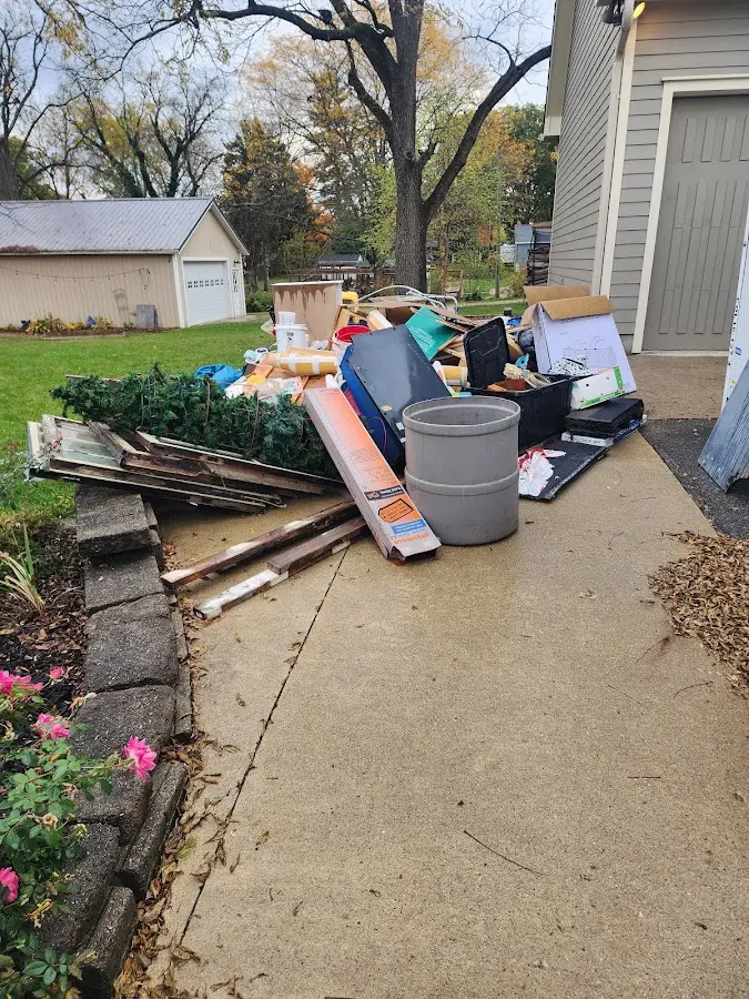 Dumpster being loaded with debris for Roofing Dumpster Rental in Le Roy